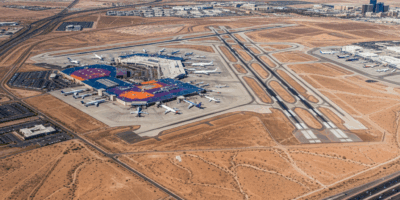 Aerial view of Las Vegas Harry Reid International Airport with desert landscape and colorful termina